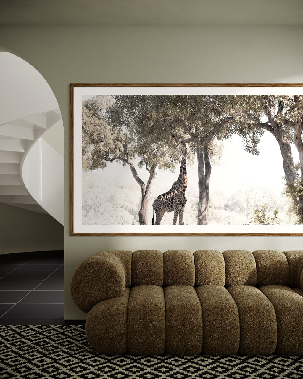 Modern interior featuring a framed artwork of a portrait of a giraffe eating from a tree by Francoise V Fine Art Gallery in Cape Town, South Africa