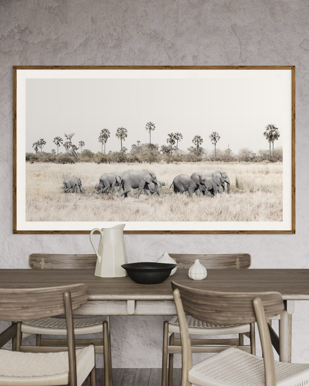Modern interior featuring a framed artwork of a portrait of a herd of elephants walking through grass by Francoise V Fine Art Gallery in Cape Town, South Africa