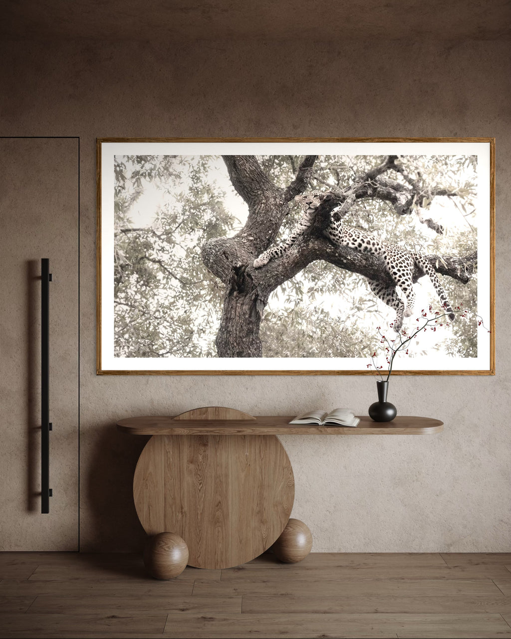 Modern interior featuring a framed artwork of a portrait of a leopard in a tree by Francoise V Fine Art Gallery in Cape Town, South Africa