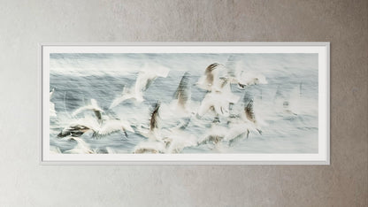 White box-framed artwork print of a Flock of birds flying over a snowy landscape by Francoise V Fine Art Gallery in Cape Town, South Africa